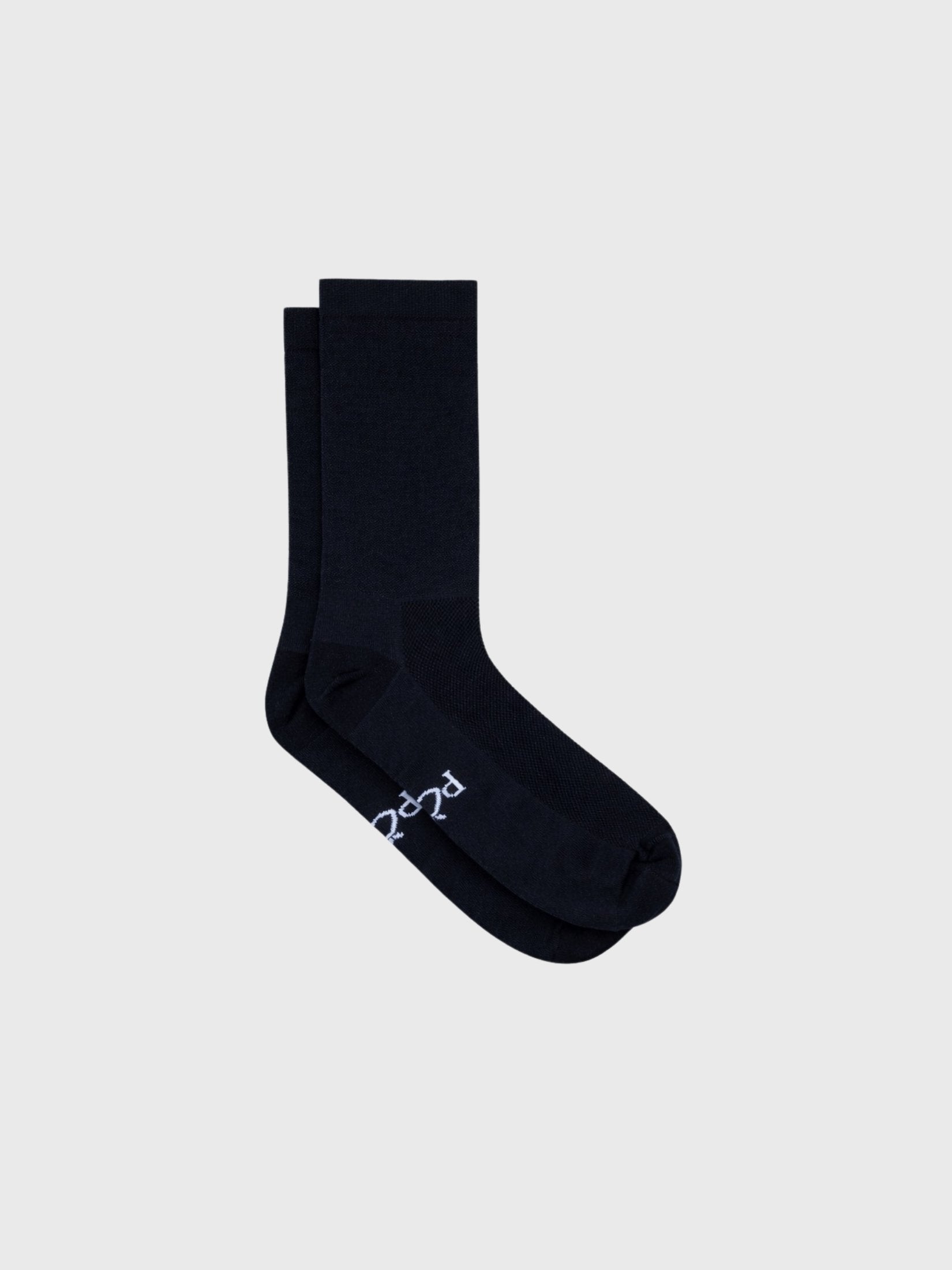 Single plain black cycling sock side profile. Minimalist 18cm cuff height with high compression fit and no visible logos.