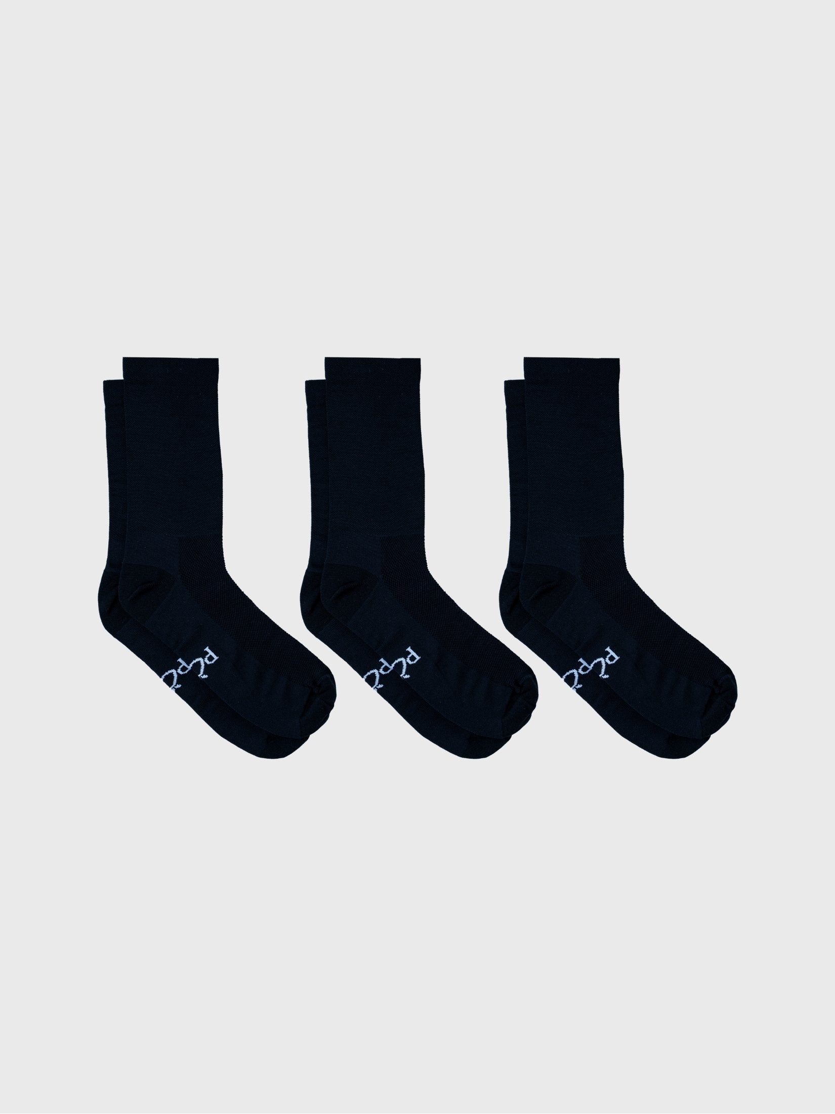 3-pack bundle of POP Cycling Co. plain black socks arranged in a row. High compression cycling socks with Fade Resistant deep black fabric.