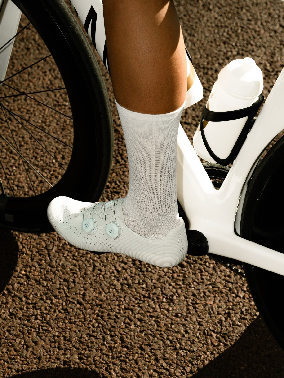 Person wearing white cycling socks