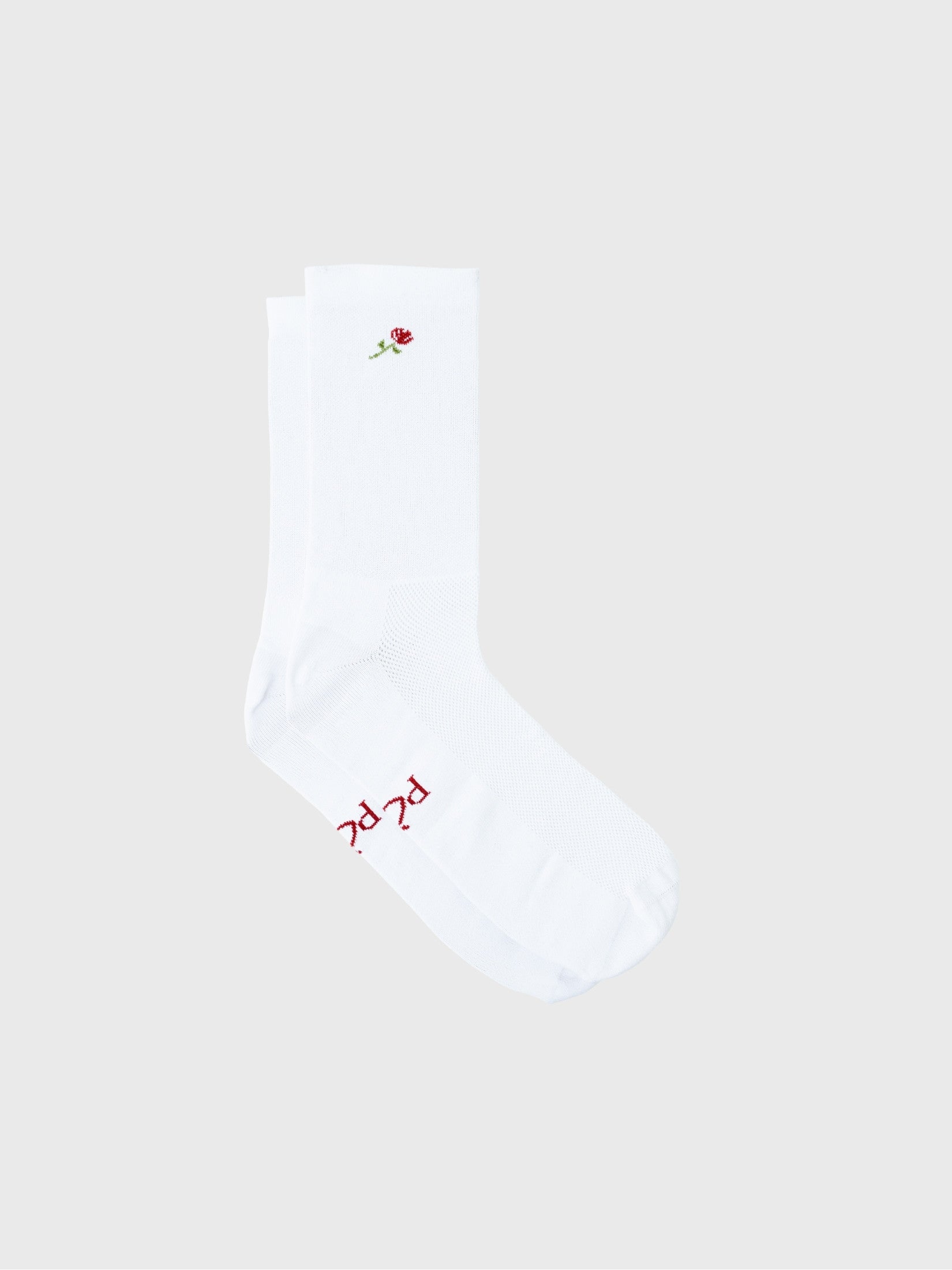 Pair of white POP Cycling Co. socks with red rose flower pattern laid flat, showing reinforced heel.