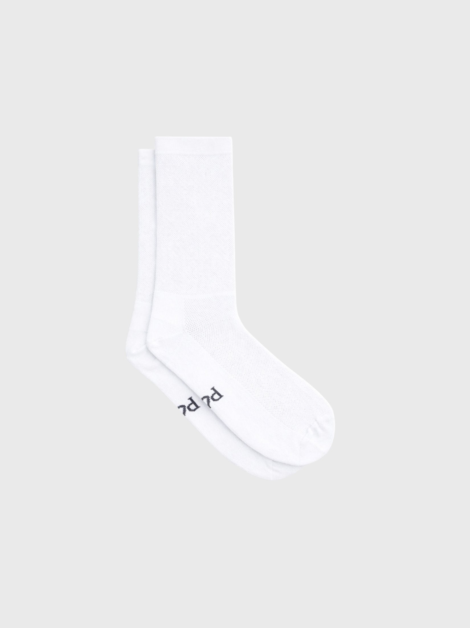 Plain white cycling socks with no logos. Minimalist unbranded design with high compression fit and 18cm cuff for a clean pro look.
