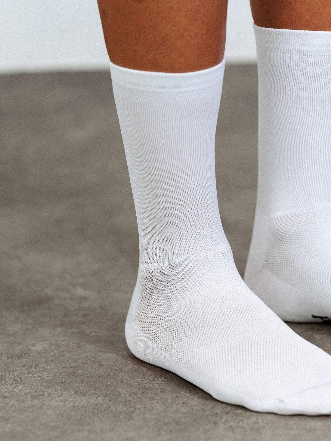 Close-up of "Permanent White" fabric technology. Stain-resistant Q-Skin polyamide that stays white wash after wash.